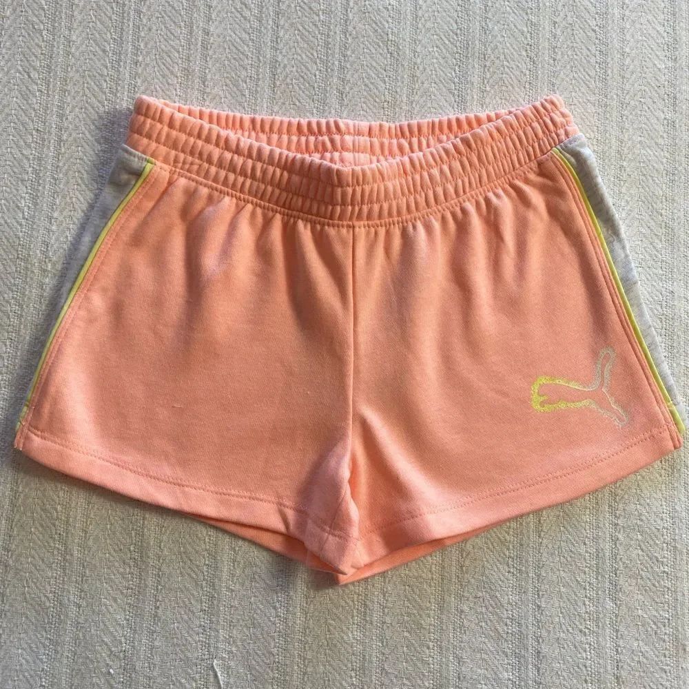 PUMA Girls Rebel Shorts Color: Elektro Peach